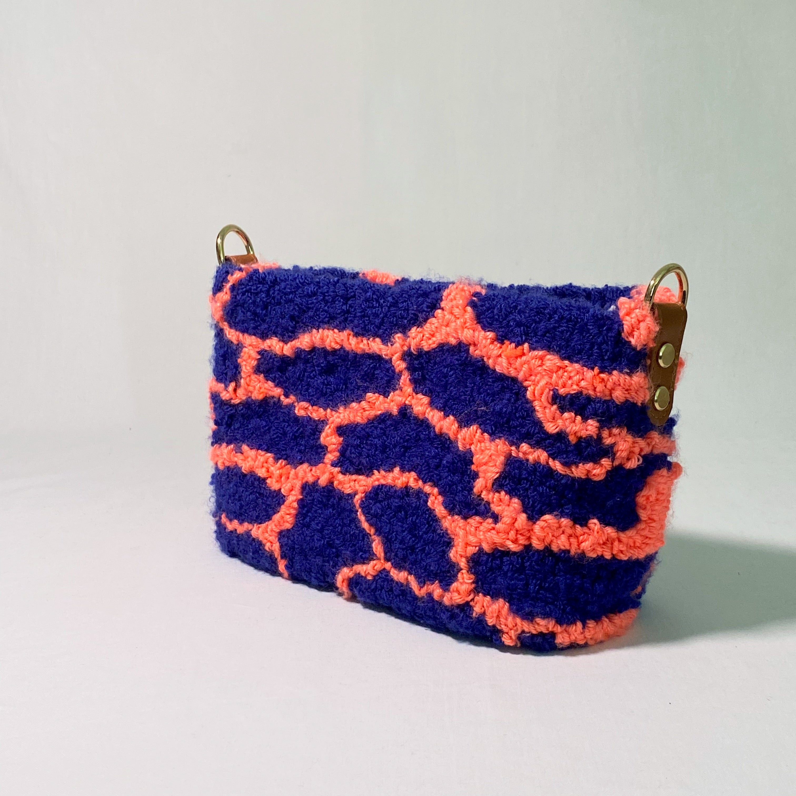 Ohpunch Pochette Lido handmade punch needle bag angled view.