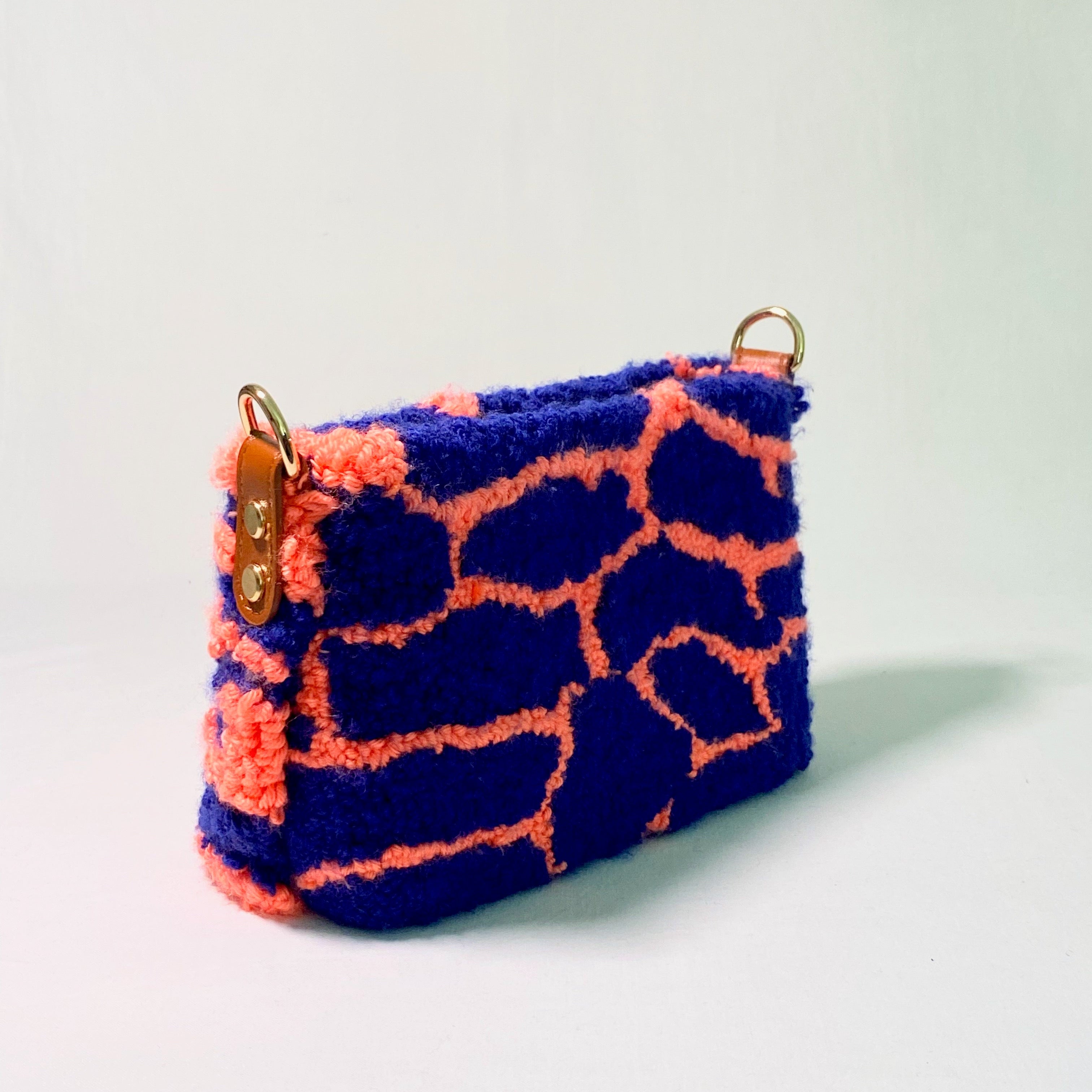 Handmade Pochette Lido crossbody punch needle bag from Ohpunch, side view.