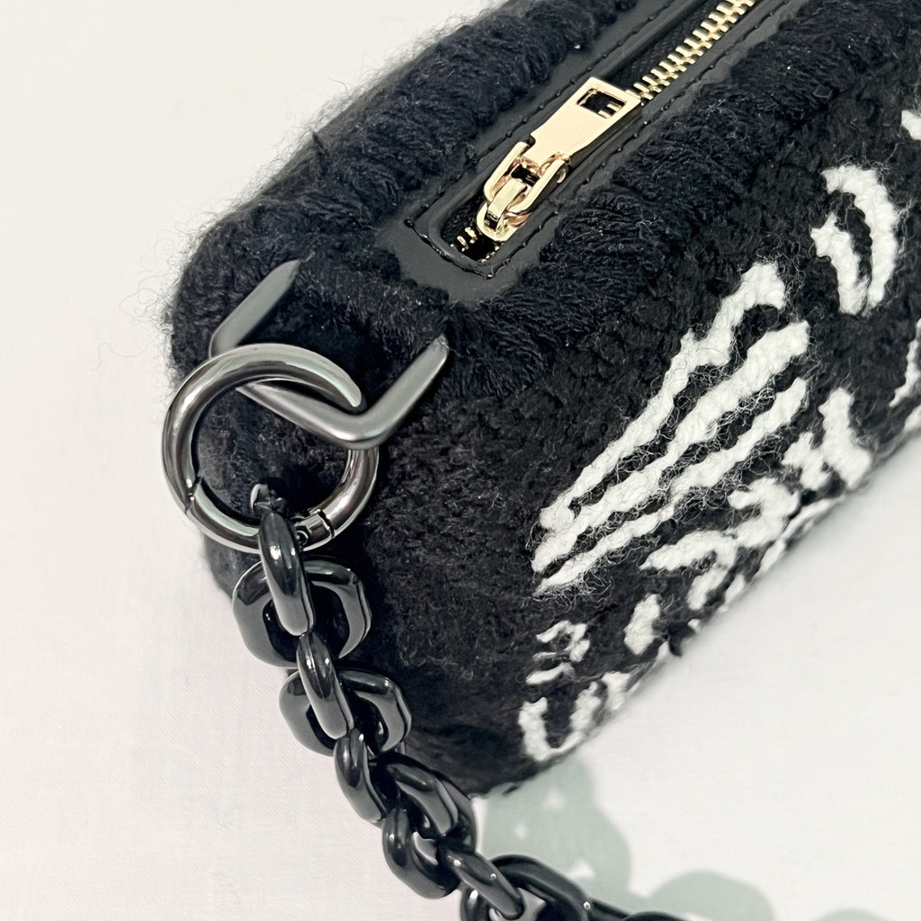 Close-up of side stitching on Ohpunch Pochette Water Cipher punch needle DIY bag.