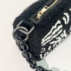 Close-up of side stitching on Ohpunch Pochette Water Cipher punch needle DIY bag.
