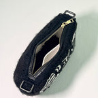 Top view of Ohpunch Pochette Water Cipher punch needle bag showing zipper closure.